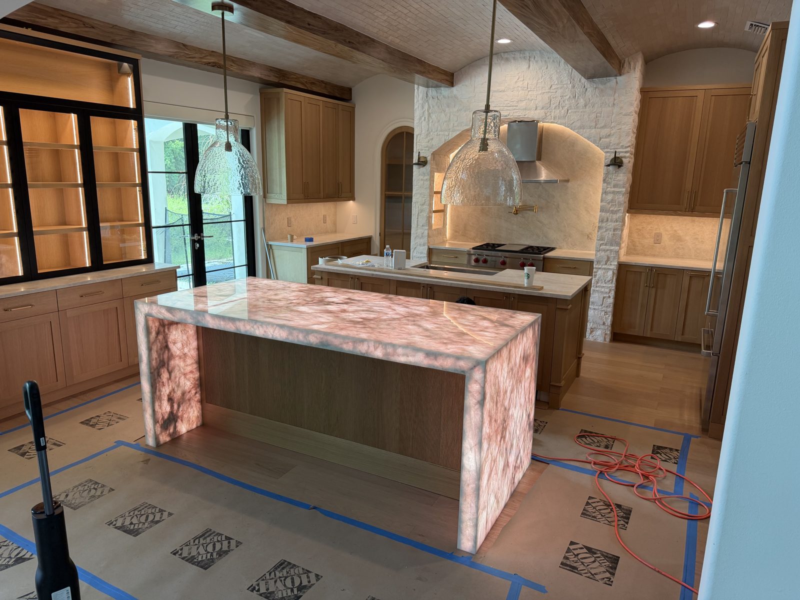 Backlit pink onyx kitchen island